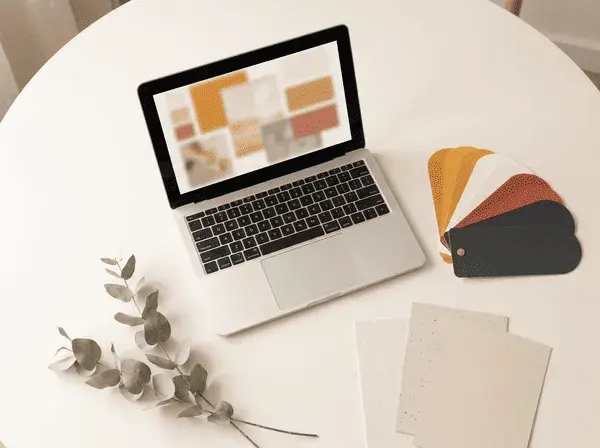 WritePage AI theme creator turning a few words into a finished blog design, shown with color swatches and a laptop displaying a generated layout
